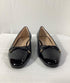 Women's Stuart Weitzman Sleek Cap Toe Bow Flats in Black Leather