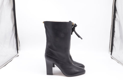 Women's Stuart Weitzman Jett Front-Zipped Mid-Calf Boots in Black Leather