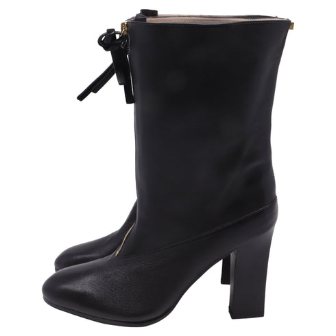 Women's Stuart Weitzman Jett Front-Zipped Mid-Calf Boots in Black Leather
