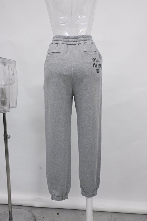 Women's Miu Miu Embroidered Logo Track Pants in Grey Cotton
