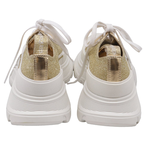 Women's Alexander McQueen Tread Slick Glitter Sneakers in Metallic Gold Canvas
