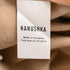 Women's Nanushka Mitsu High-Rise Pleated Trousers in Brown Faux Leather
