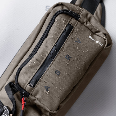 0703. Cordura® Tech Crossbody Pack - Deep Taupe
