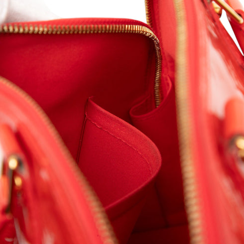 Alma Handbag Monogram Vernis PM